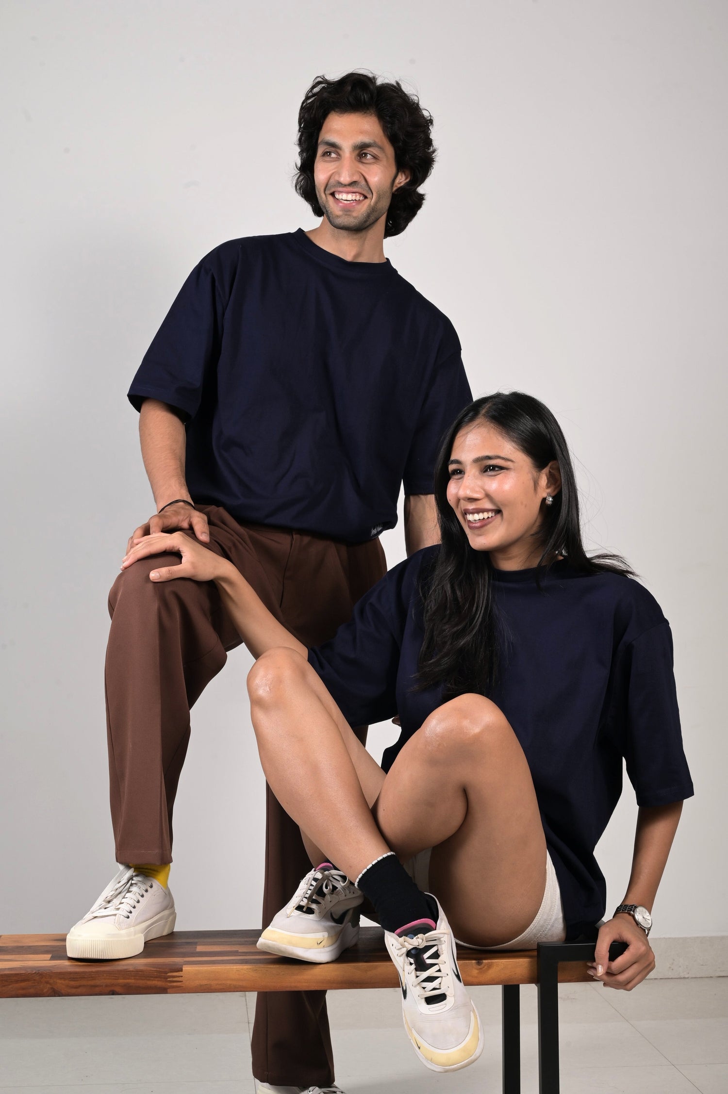 man and woman laughing wearing a staple navy blue tshirt